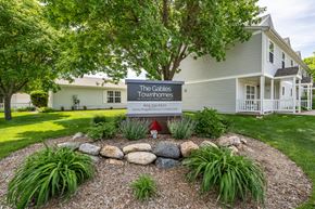 Sioux Falls townhouse for rent - A sign for The Gables Townhomes is in front of a house.