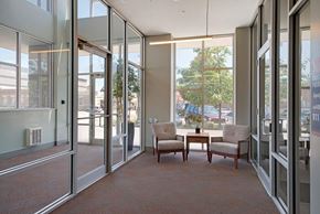 Omaha apartment for rent - a conference room with a table and chairs and glass doors