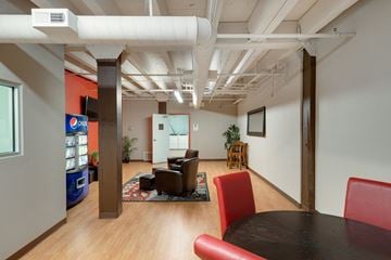 Omaha apartment for rent - a dining room and living room with a table and chairs