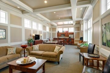 West Des Moines apartment for rent - a large living room with couches and tables and a kitchen