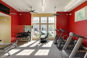West Des Moines apartment for rent - a gym with red walls and a large window