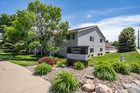 Sioux Falls apartment for rent - A sign for Oakmont Estates is in front of a building.