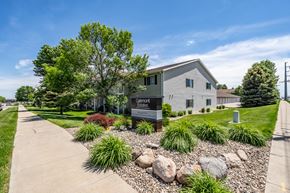 Sioux Falls apartment for rent - A building with a sign that says "Quiltport" in front of it.