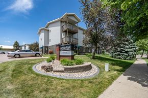 Sioux Falls apartment for rent - A building with a sign that says "Cobblestone Park" in front of it.