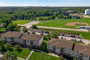 Plattsmouth apartment for rent - an aerial view of a group of buildings and a baseball field