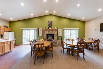 Sioux Falls apartment for rent - the dining room and living room of a house with a table and chairs