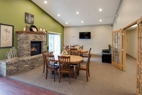 Sioux Falls apartment for rent - a dining room with a table and a fireplace