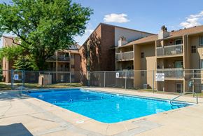West Des Moines apartment for rent - a swimming pool in front of an apartment building