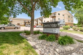 Sioux Falls apartment for rent - A sign for Sierra Vista in front of a building.