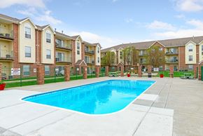 Omaha apartment for rent - our apartments at the district feature a swimming pool and an apartment building