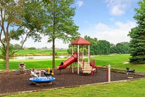 Bellevue apartment for rent - a playground with a red slide in a park