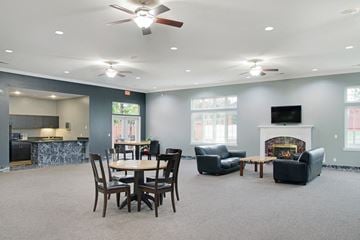 Bellevue apartment for rent - a living room with a table and chairs and a fireplace