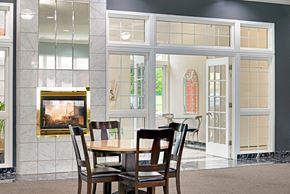 Bellevue apartment for rent - a dining room with a table and chairs in front of a fireplace