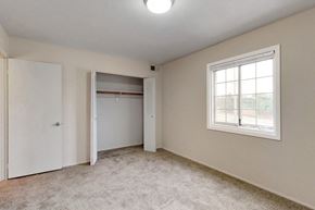 Omaha apartment for rent - an empty bedroom with a closet and a window