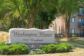 West Des Moines apartment for rent - a sign manor in front of a building