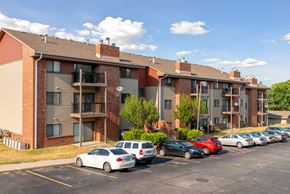 Des Moines apartment for rent - an apartment building with cars parked in a parking lot