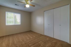 Fremont apartment for rent - an empty bedroom with a ceiling fan and a window