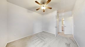Davenport apartment for rent - an empty bedroom with a ceiling fan and a door to a bathroom