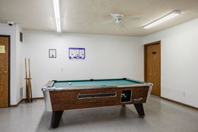 Davenport apartment for rent - a game room with a pool table and a ceiling fan