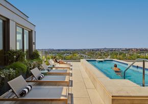 Washington apartment for rent - A person is sitting in a pool on a sunny day.