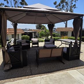 San Ysidro apartment for rent - A patio with a white canopy and black chairs.