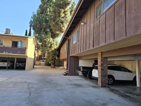 Santa Fe Springs multi-family for rent - A parking garage with a white car parked in the bottom right.