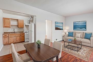 Downey multi-family for rent - A dining room with a table and chairs.