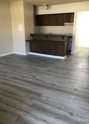 Covina multi-family for rent - A kitchen with wooden cabinets and a countertop.