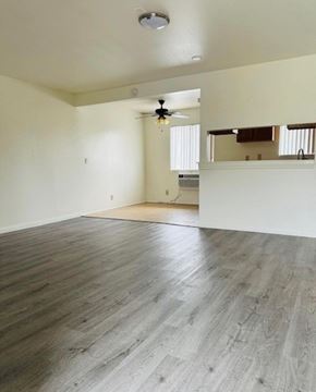 Glendora multi-family for rent - A room with wooden flooring and a ceiling fan.