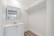 Pico Rivera multi-family for rent - A white bathroom with a sink and mirror.