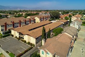 Baldwin Park multi-family for rent - Apartment complex with a parking lot in front.