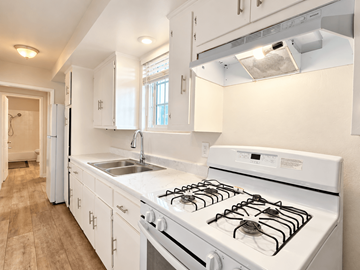 El Monte multi-family for rent - A white kitchen with a stove and sink.