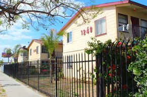 Sun Valley multi-family for rent - A yellow house with the number 1249 on it.