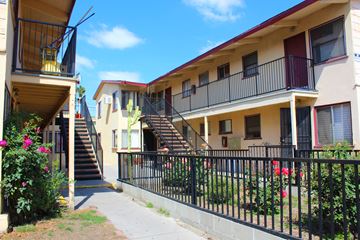 Sun Valley multi-family for rent - A row of apartment buildings with balconies and staircases.