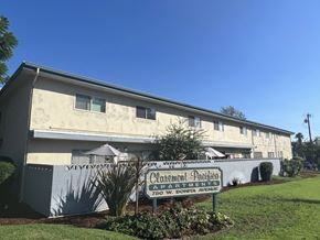 Claremont multi-family for rent - A building with a sign that says "Carmelton Pacifica Apartments" in front of it.