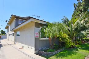 Downey multi-family for rent - A house with a sign on the front that says "No Parking".