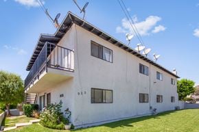 Azusa apartment for rent - A white two-story house with a balcony on the second floor.