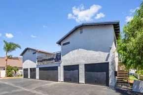 Azusa apartment for rent - A two-story house with a garage and a balcony.