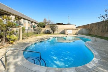 Upland multi-family for rent - A small pool with a metal railing.