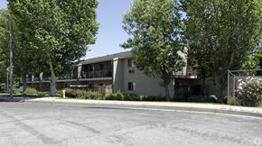 Ontario apartment for rent - A building with a parking lot in front of it.
