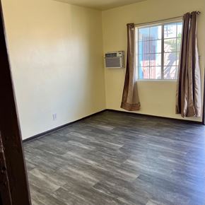North Hollywood apartment for rent - A room with a window and curtains.