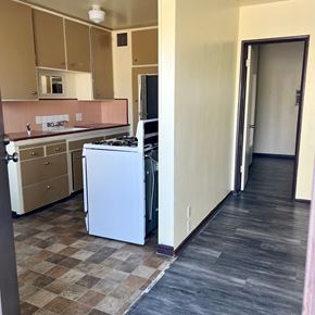 North Hollywood apartment for rent - A kitchen with a checkered floor and a white dishwasher.