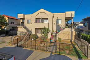 South El Monte multi-family for rent - A house with a gate in front of it.