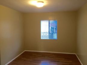 Los Angeles apartment for rent - A room with a window and wooden flooring.