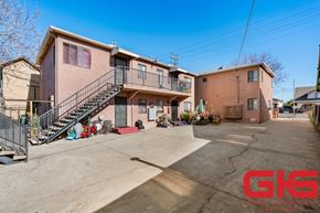 Los Angeles multi-family for rent - A sunny day at a residential complex with a clear blue sky.