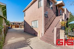Los Angeles multi-family for rent - A house with a staircase leading to the front door.