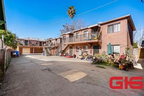 Los Angeles multi-family for rent - A sunny day in a residential area with a house and a clear blue sky.