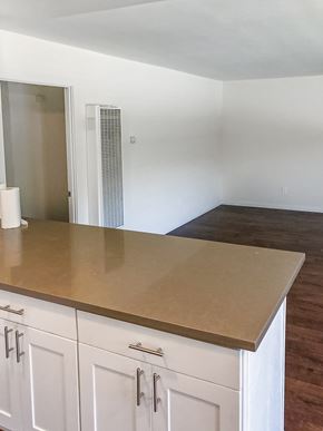 Monrovia multi-family for rent - A kitchen with white cabinets and a countertop.