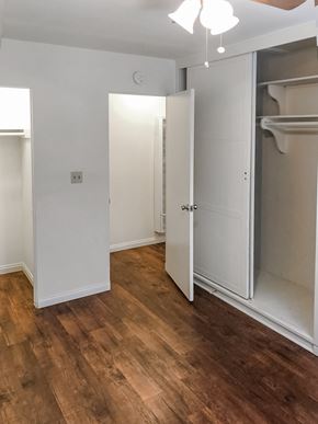 Monrovia multi-family for rent - A white door is open to a room with wood flooring.