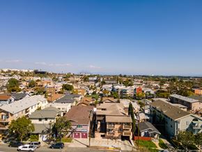 Long Beach multi-family for rent - A residential area with houses and cars.